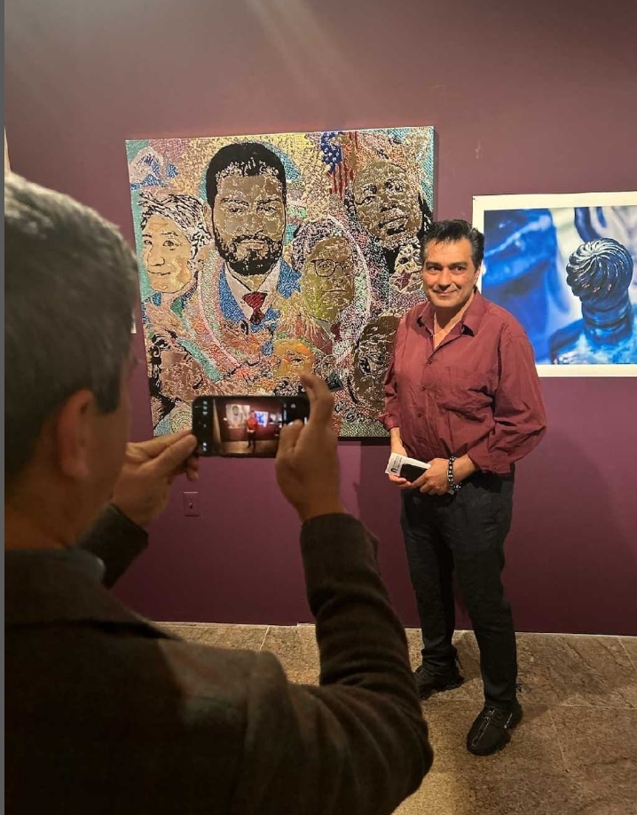 Artist at REN ART GALLERY with artwork